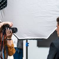 A photographer takes a headshot at a Career Bootcamp